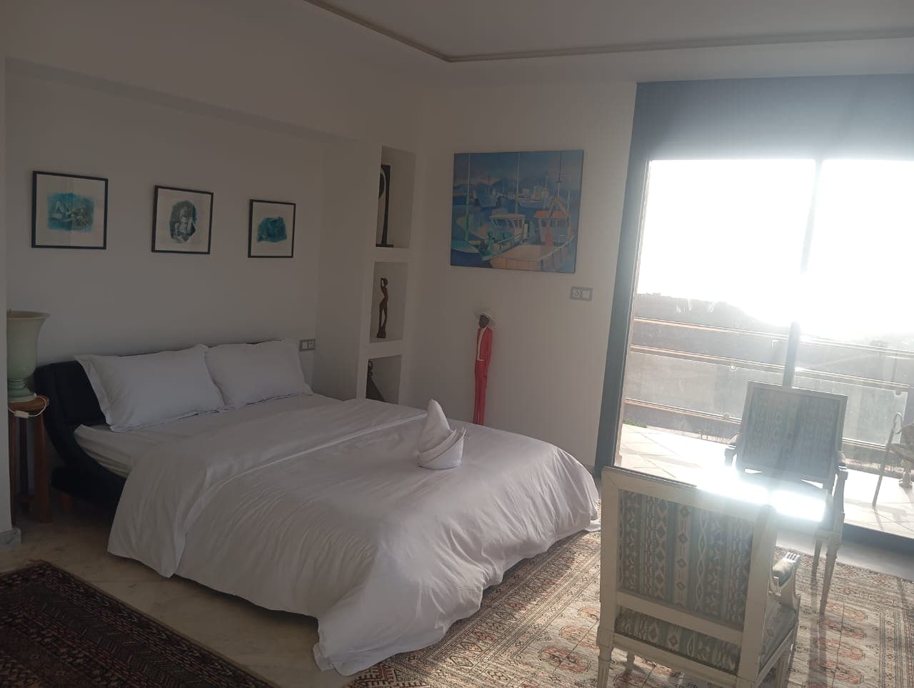Hotel bedroom with balcony and ocean views