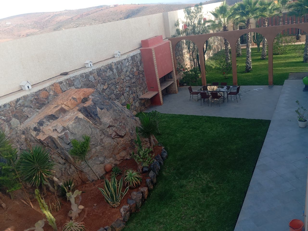 Hotel garden terrace with stone architecture
