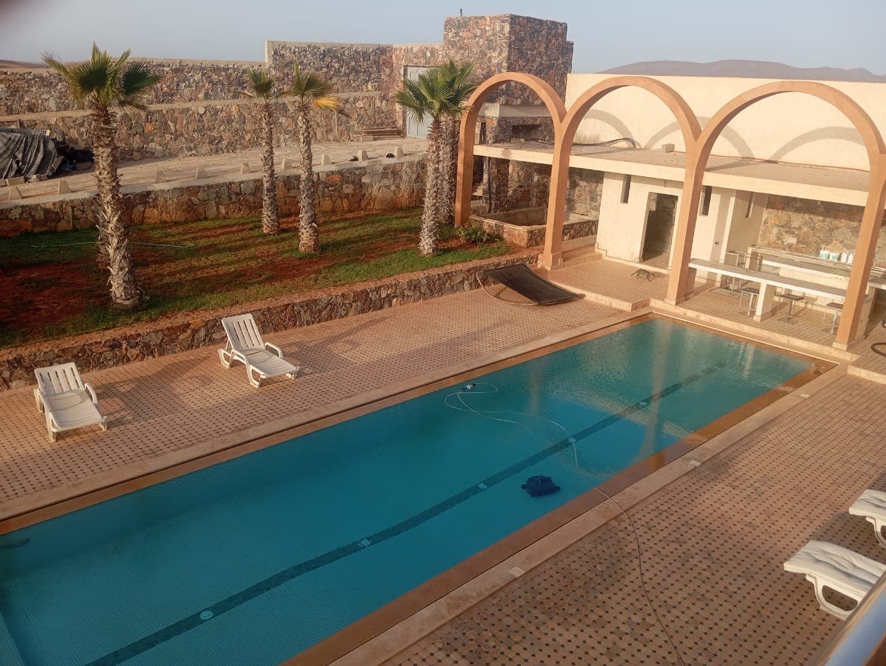 Hotel swimming pool with traditional Moroccan arches