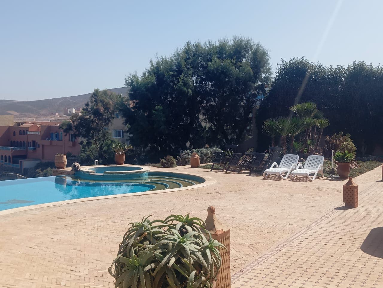 Pool and spa area with desert landscaping