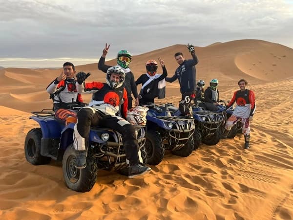 Quad biking adventure in desert dunes